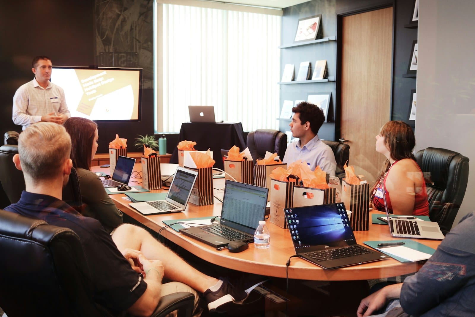 A team mapping strategy together at a laptop.